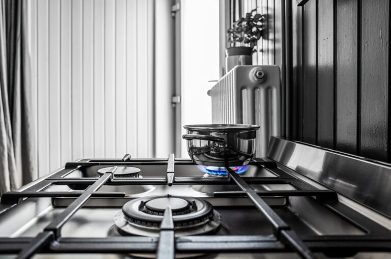 A small metal pan on the stove in the kitchen
